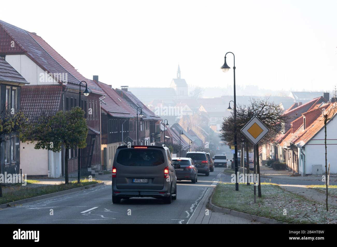 Germany, Saxony-Anhalt, Hasselfelde, transit road, parish church in the background, Oberharz am Brocken. Stock Photo
