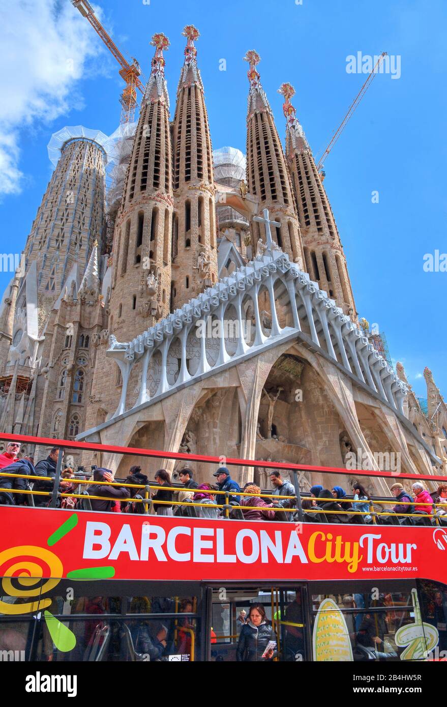 City tour bus with the Sagrada Familia cathedral by Antoni Gaudi in Barcelona, Catalonia, Spain Stock Photo