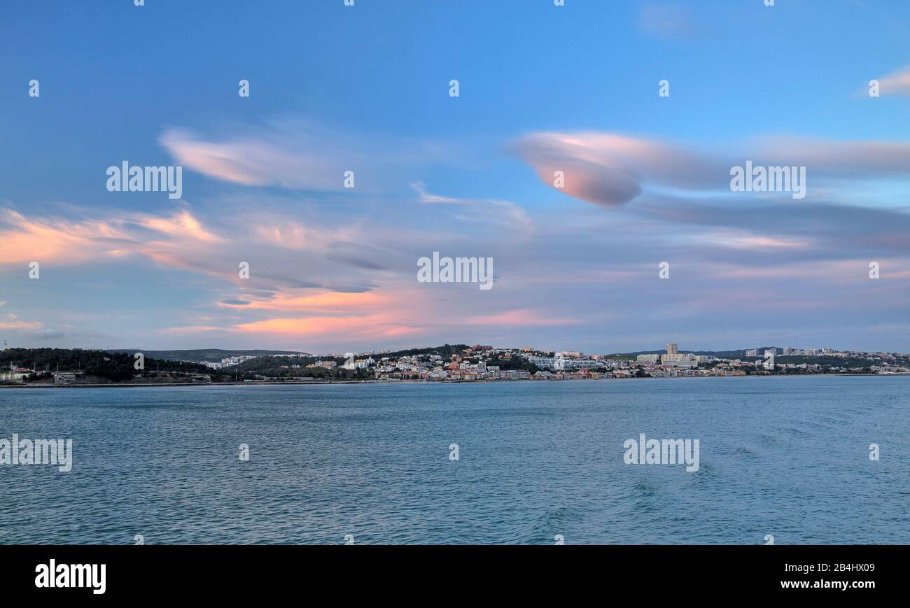 Outskirts of the city at the Tejo estuary at evening mood, Lisbon, Portugal Stock Photo