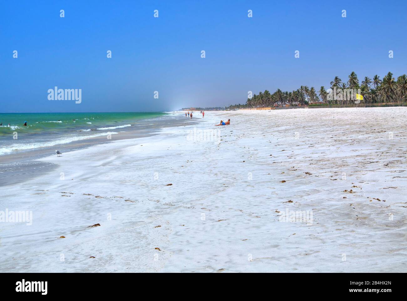 Palm beach with bathers, Salalah, Arabian Sea, Oman Stock Photo