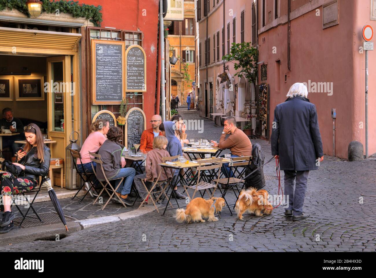 Old town alley with street cafe, Rome, Lazio, Italy Stock Photo