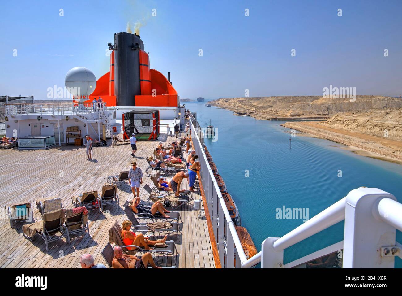 Upper deck with sun loungers and chimney of the transatlantic liner Queen Mary 2 in the Suez Canal (Suez Canal), Egypt Stock Photo