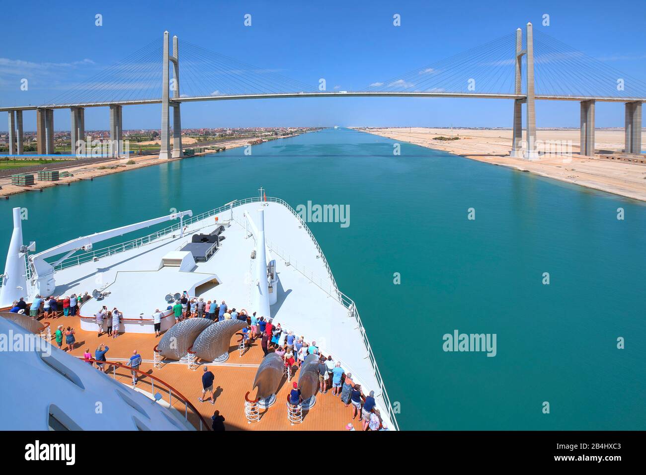 Transatlantic liner Queen Mary 2 in front of the Suez Canal bridge near Port Said in the Suez Canal, Egypt Stock Photo