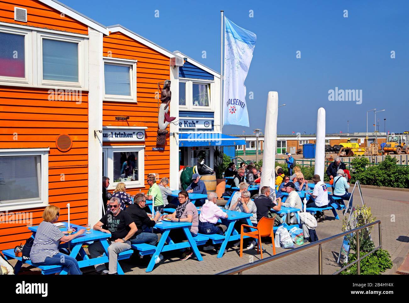 Outdoor terrace of the restaurant Bunte Kuh in Hummerbuden at the harbor, Helgoland, Helgoland Bay, German Bight, North Sea Island, North Sea, Schleswig-Holstein, Germany Stock Photo