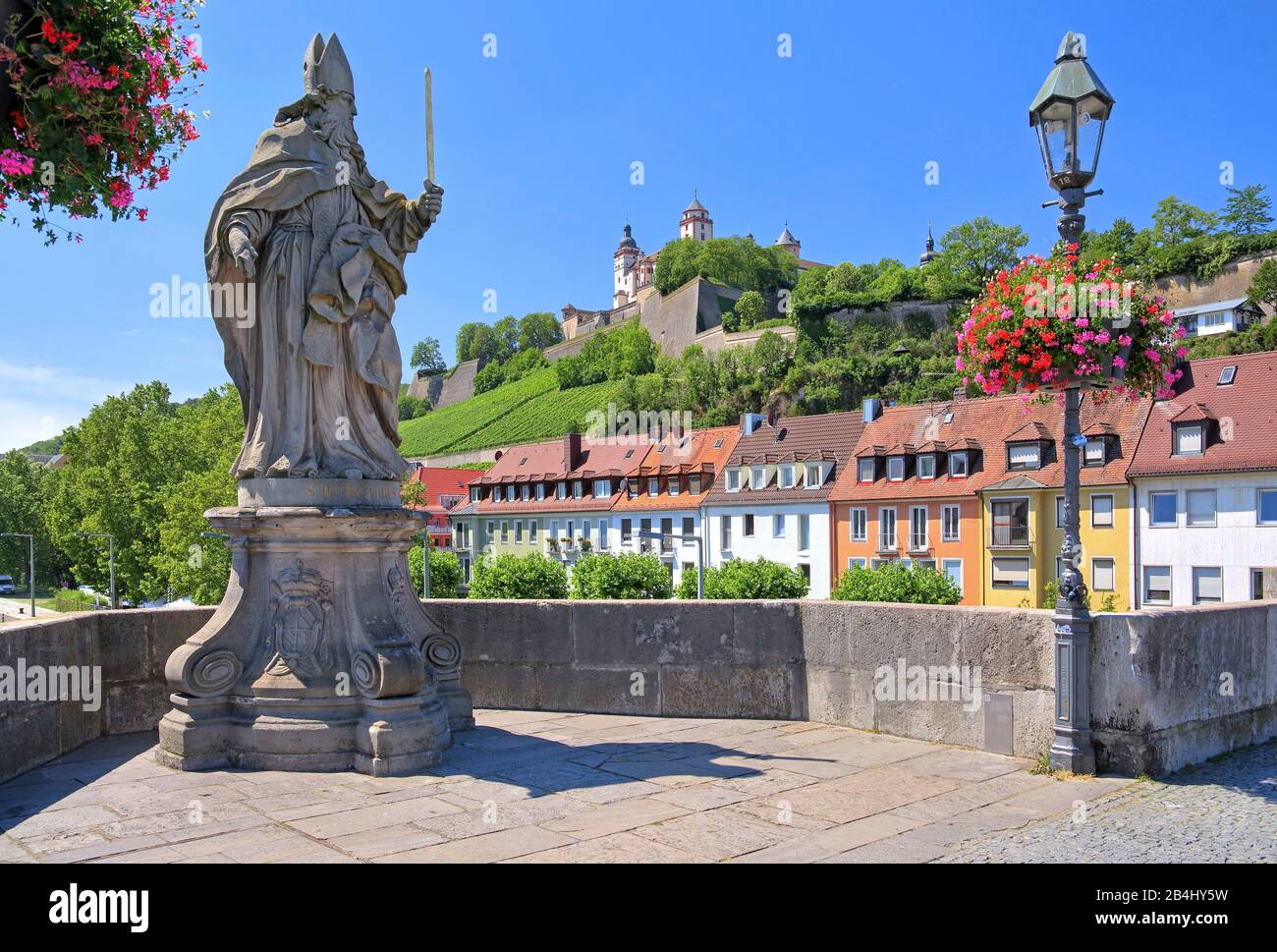 Saint figure on the Alte Mainbrücke and fortress Marienberg, Würzburg, Maintal, Lower Franconia, Franconia, Bavaria, Germany Stock Photo
