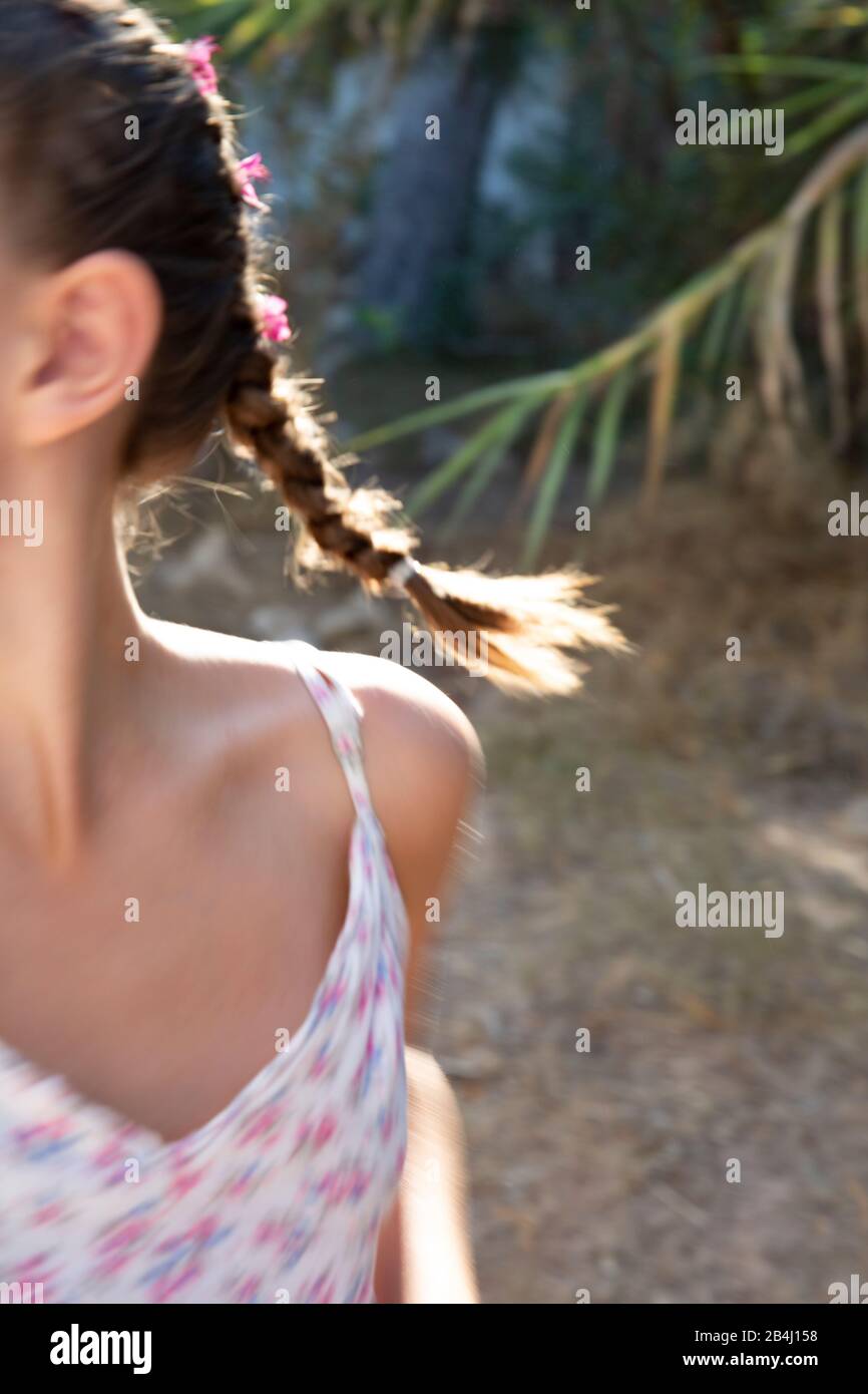 Girl, braids, flowers, movement, portrait, cropped Stock Photo