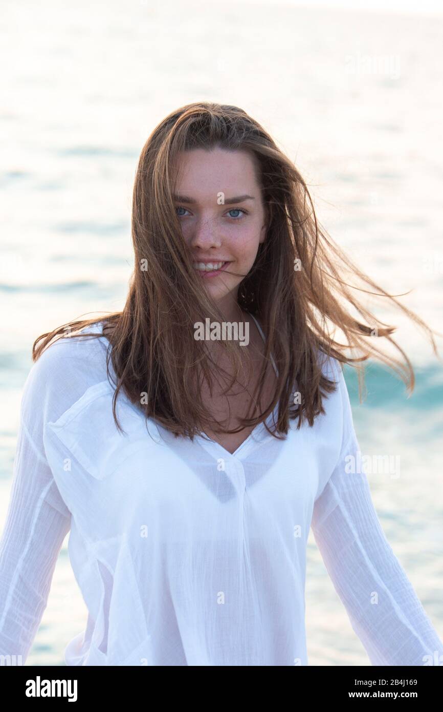 Teenagers, turning, smiling, open hair Stock Photo