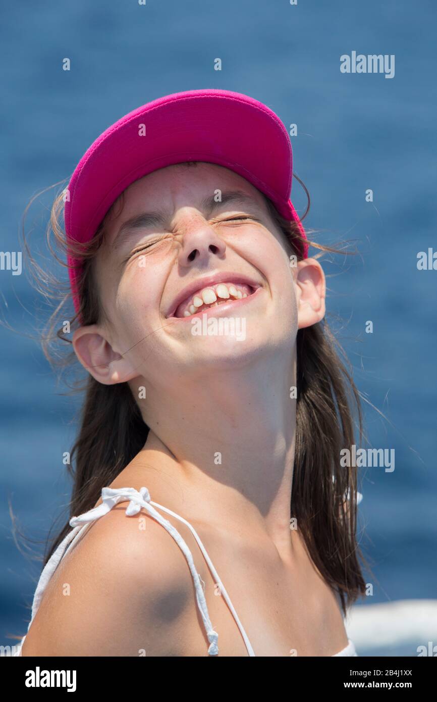 girl with cap, grin, portrait Stock Photo