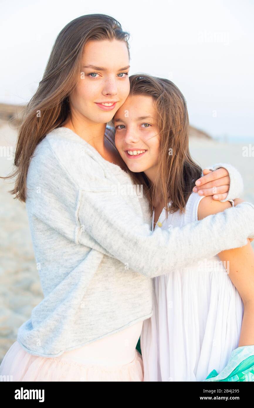 Siblings, hug, morning light Stock Photo