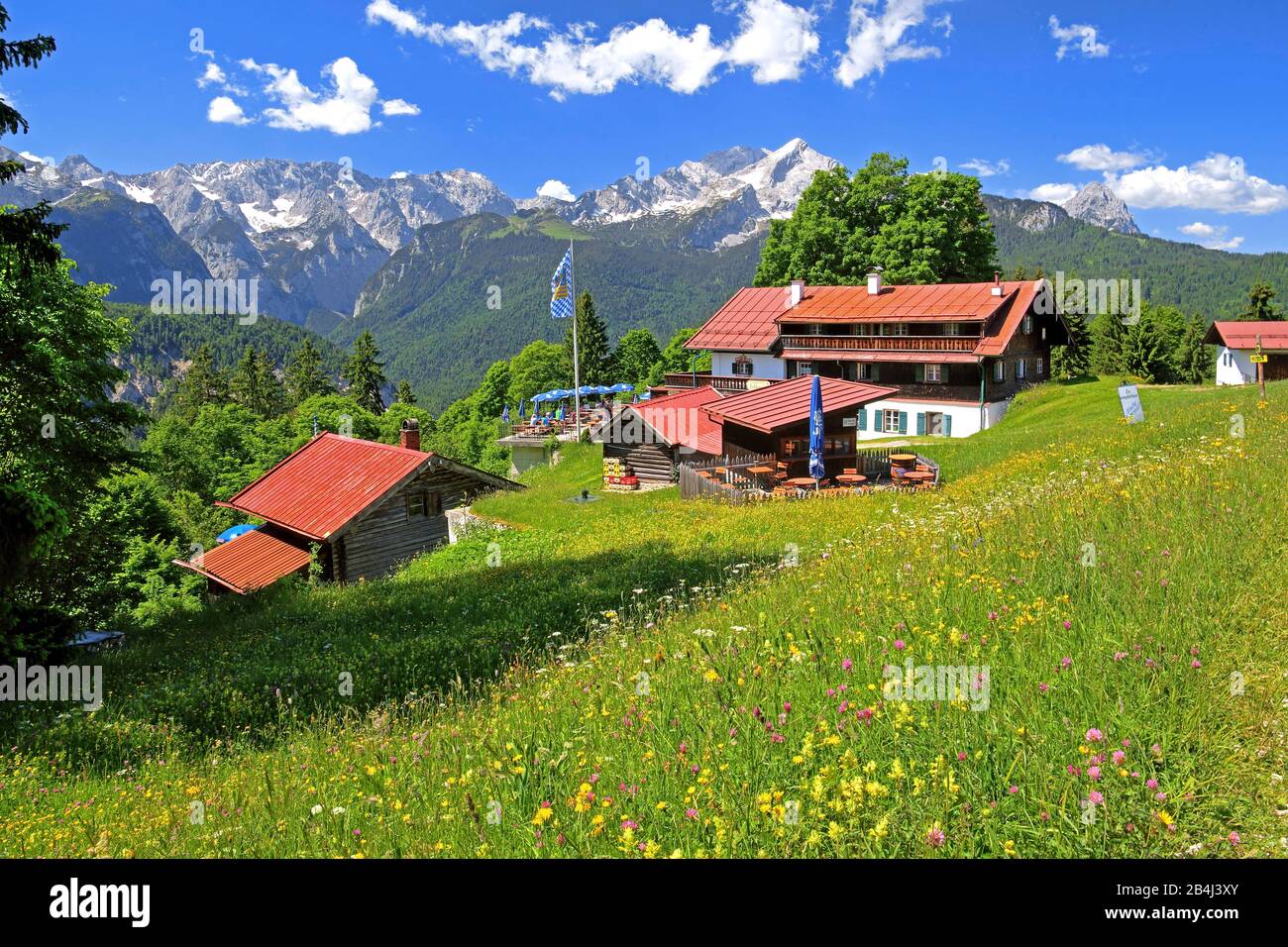 Berggasthof Eckbauer 1237m with sun terrace against the Alpspitze 2628m in the Wetterstein Mountains, Garmisch-Partenkirchen, Loisachtal, Werdenfelser Land, Zugspitzland, Upper Bavaria, Bavaria, Germany Stock Photo