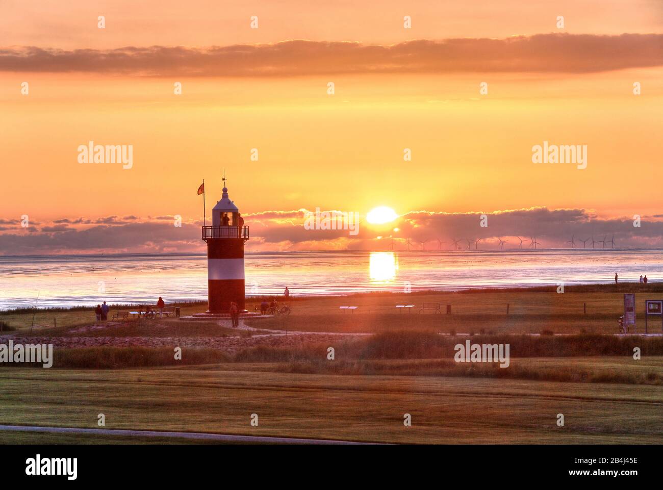 Lighthouse Kleiner Preusse am Wattenmeer at sunset, North Sea resort Wremen, Land Wursten, Weser estuary, North Sea, North Sea coast, National park Niedersächsisches Wattenmeer, Lower Saxony, Germany Stock Photo