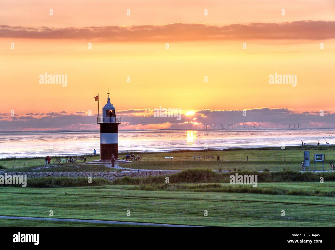 Lighthouse Kleiner Preusse am Wattenmeer at sunset, North Sea resort Wremen, Land Wursten, Weser estuary, North Sea, North Sea coast, National park Niedersächsisches Wattenmeer, Lower Saxony, Germany Stock Photo