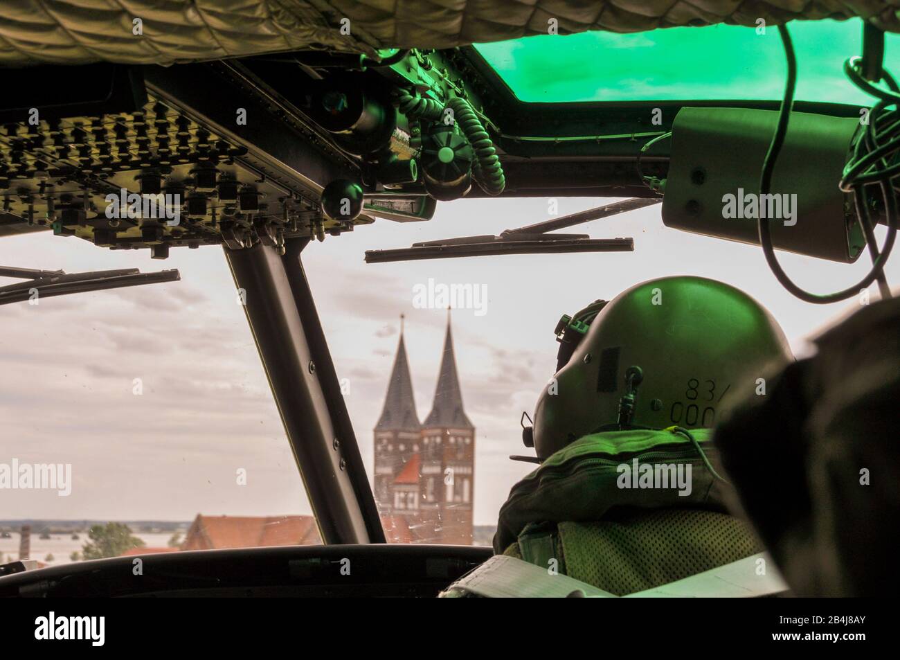 Germany, Saxony-Anhalt, Jerichow, in the cockpit of a Bundeswehr helicopter, Jerichiw with church towers, dyke break at Fischbeck, century flood 2013, Germany. Stock Photo