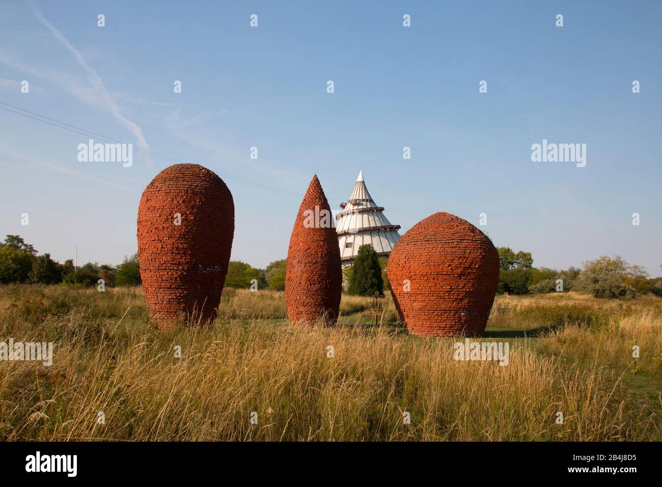 Germany, Saxony-Anhalt, Magdeburg: view of three brick cones and the millennium tower in Elbauenpark Magdeburg, Germany. Stock Photo