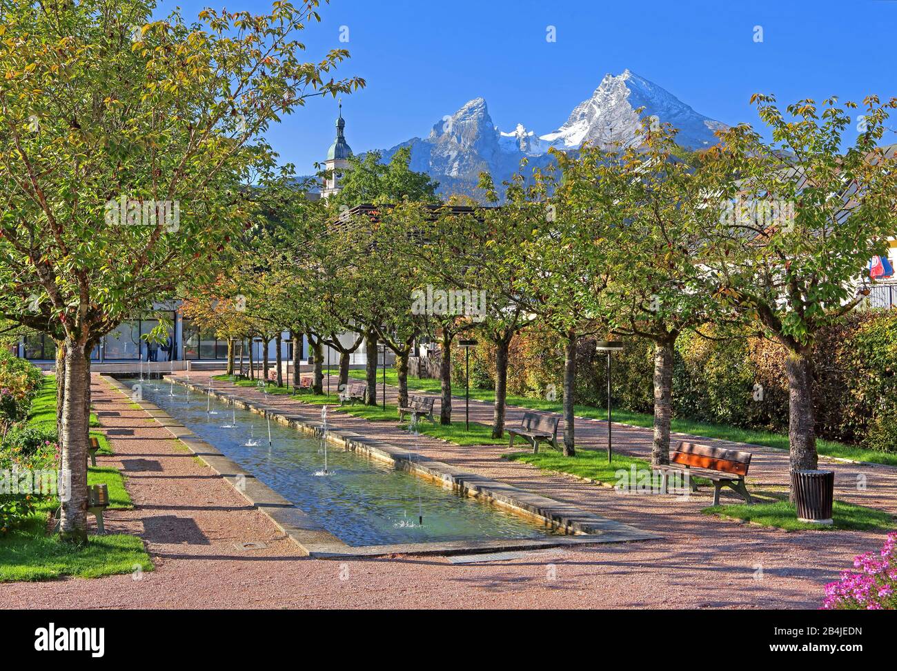 City garden with water basin and fountain against the Watzmann (2713m), Berchtesgaden, Berchtesgadener Land, Upper Bavaria, Bavaria, Germany Stock Photo