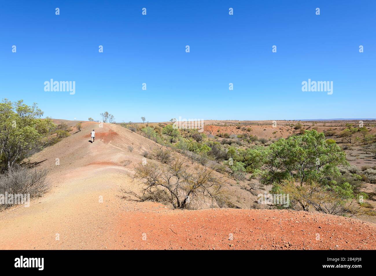 Tourist walking around Henbury craters, the site of a meteorite impact, Stuart Highway, Northern Territory, NT, Australia Stock Photo