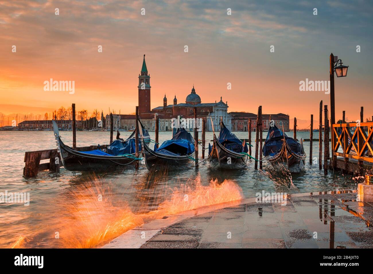 Gondolas on the Grand Canal at sunrise in Venice, Italy Stock Photo