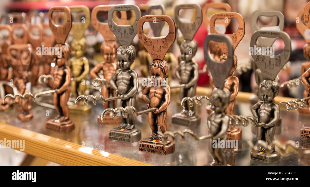 Collection of gold, brass, pewter, and bronze Manneken Pis statues made into corkscrews, bottle openers and other tourist souvenirs Stock Photo