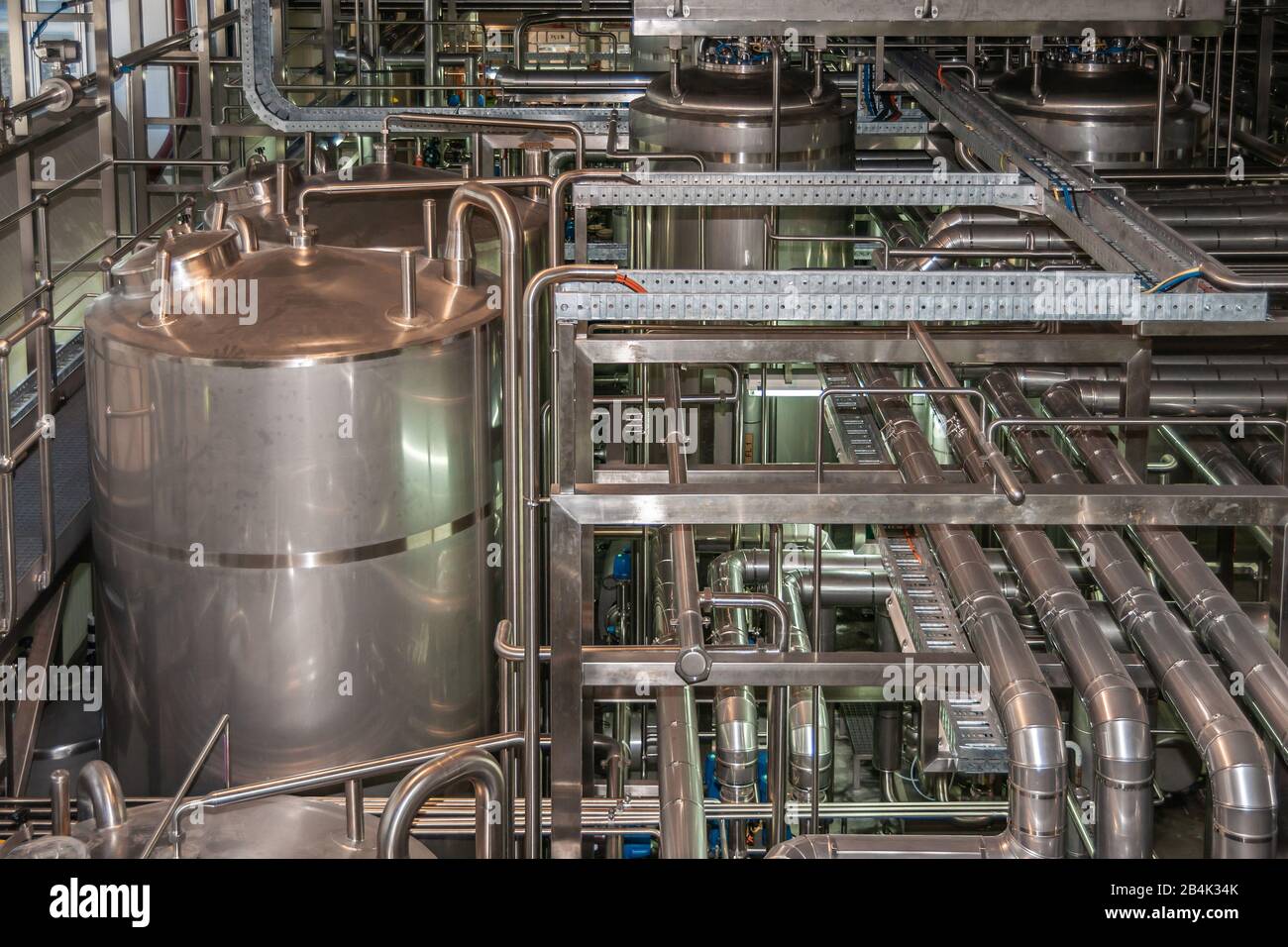 Brisbane, Australia - December 8, 2009: Castlemaine Perkins brewery. Intermediary tanks, plenty of pipelines for beer, water and CO2 in the filling pr Stock Photo