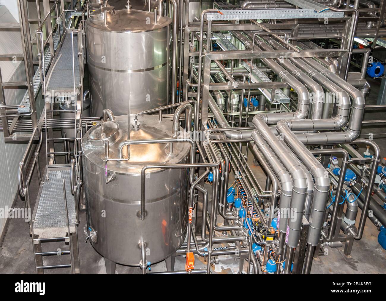 Brisbane, Australia - December 8, 2009: Castlemaine Perkins brewery. Intermediary tanks, plenty of pipelines for beer, water and CO2 in the filling pr Stock Photo