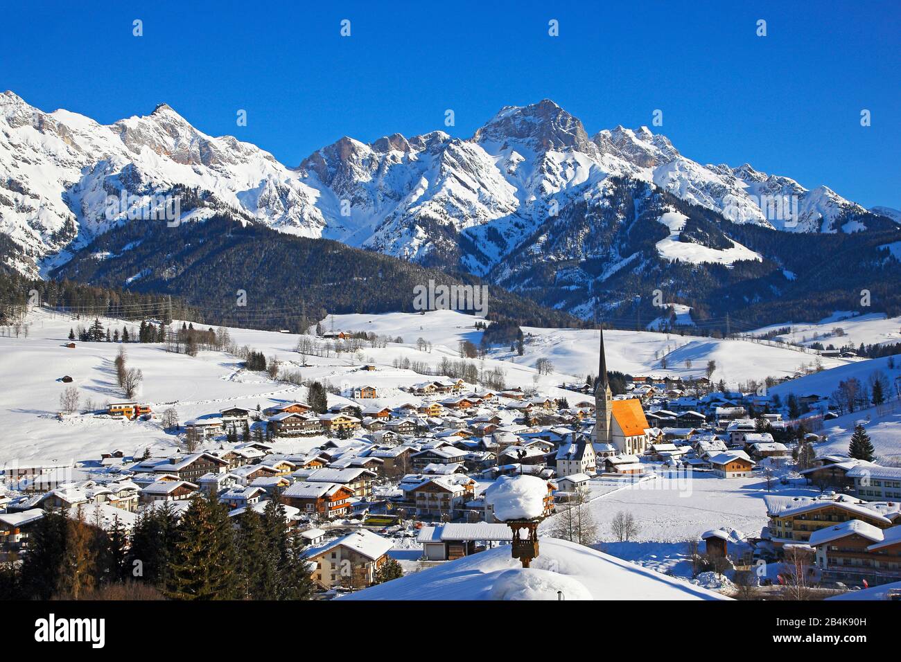 Top view of Maria Alm on the Steinernen Meer in winter with blue sky in landscape format, Stock Photo