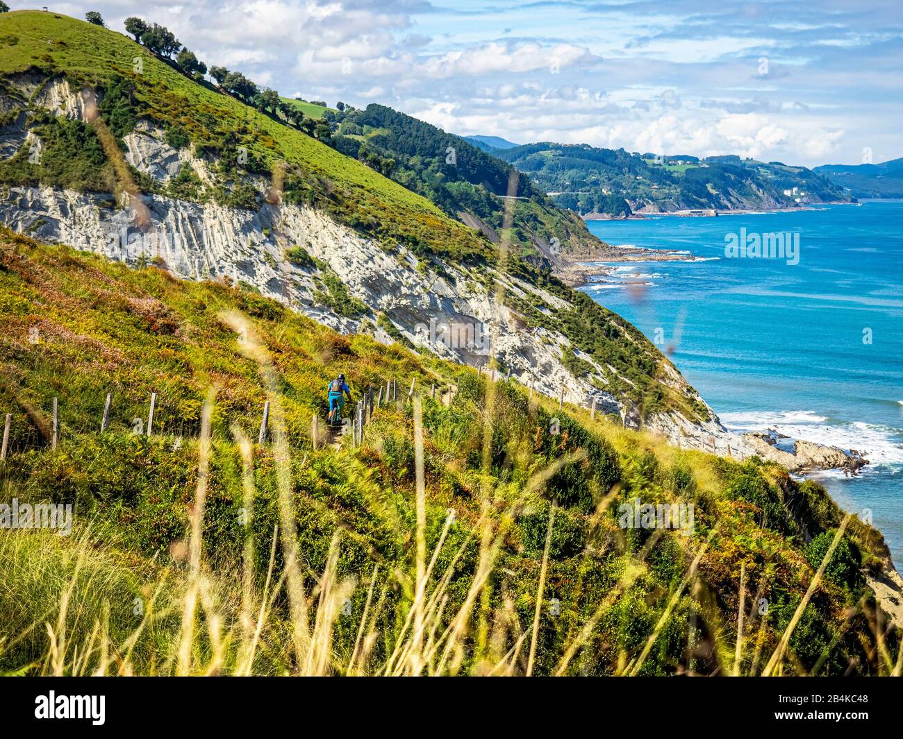 Mountain biking in the Basque Country, cliffs near Zumaia and the Basque Coast Geopark Stock Photo
