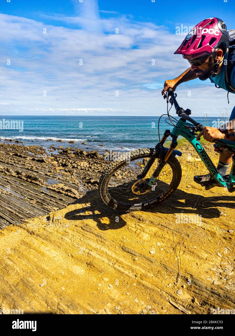 Mountain biking in the Basque Country, cliffs near Zumaia and the Basque Coast Geopark Stock Photo