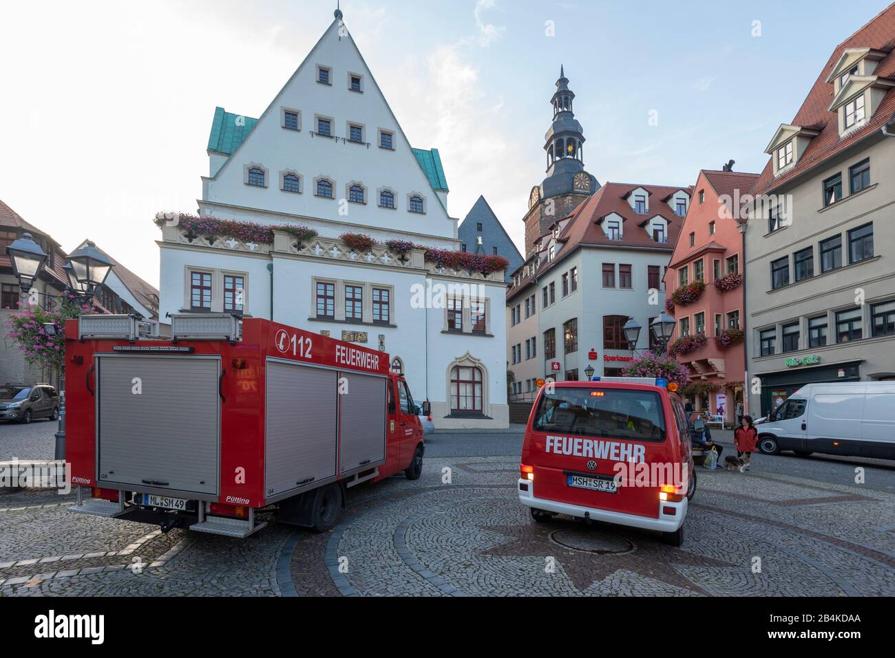 Germany, Saxony-Anhalt, Eisleben: Two fire engines stand in front of the town hall of Lutherstadt Eisleben. Stock Photo