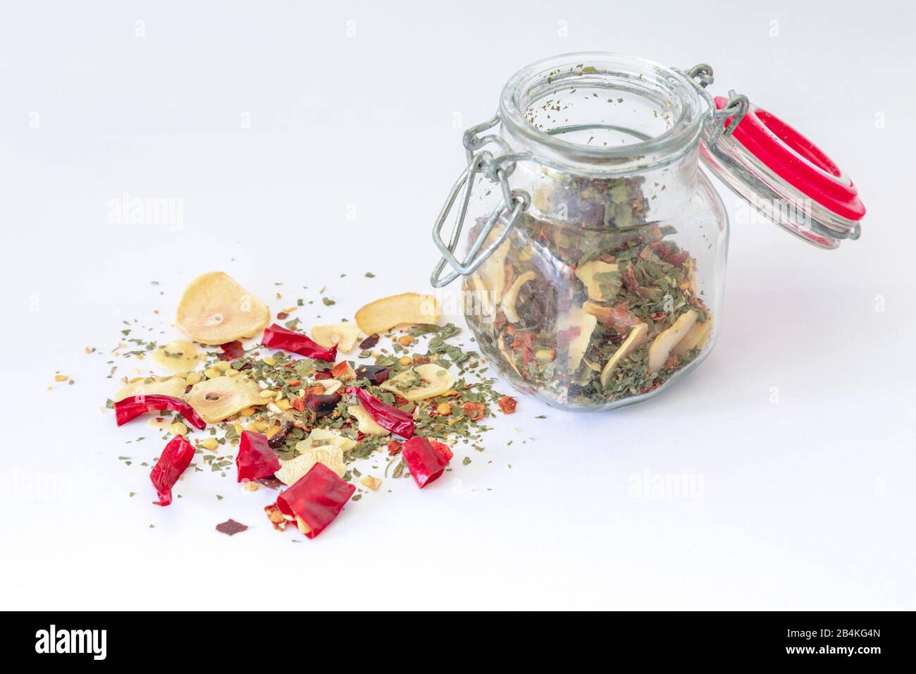 glass jar with homemade preparation for spaghetti dressing 'garlic oil and chilli' Stock Photo