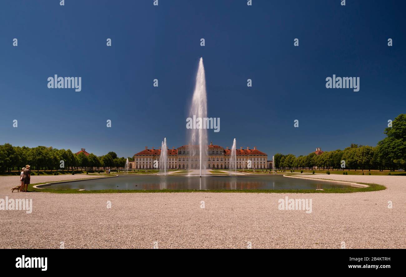 Germany, Bavaria, Schleissheim New Palace, water fountain, park visitors Stock Photo