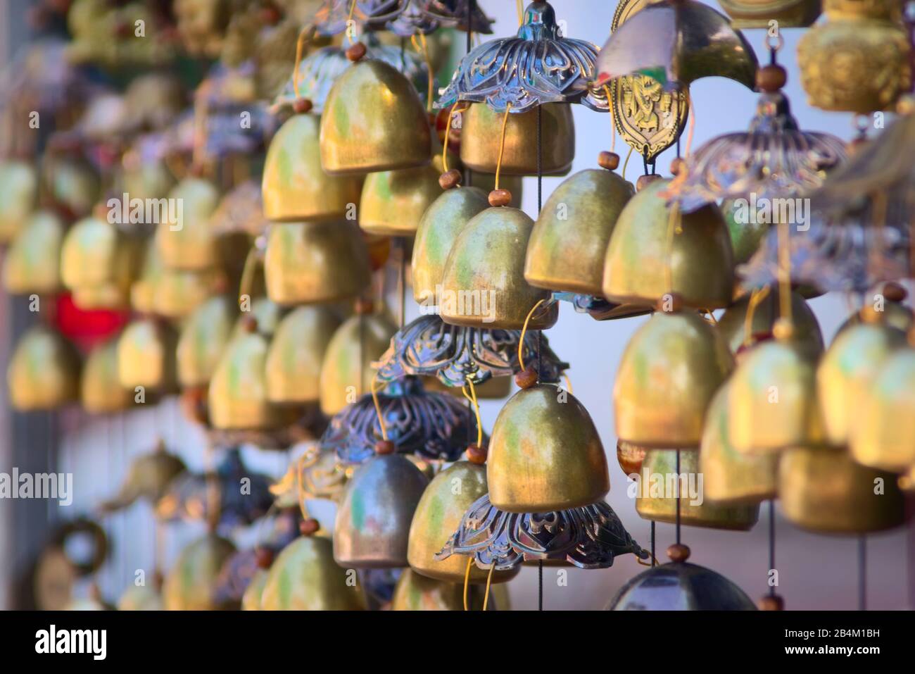 Traditional Lao chime bells at a stand in Luang Prabang, Laos. Stock Photo