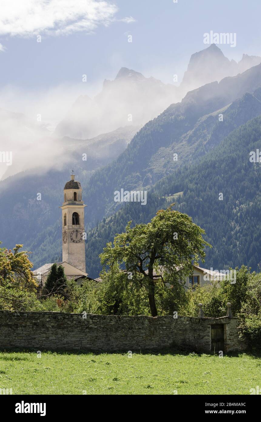 Switzerland, Graubünden, Bergell, Soglio with Sciora group in the fog Stock Photo