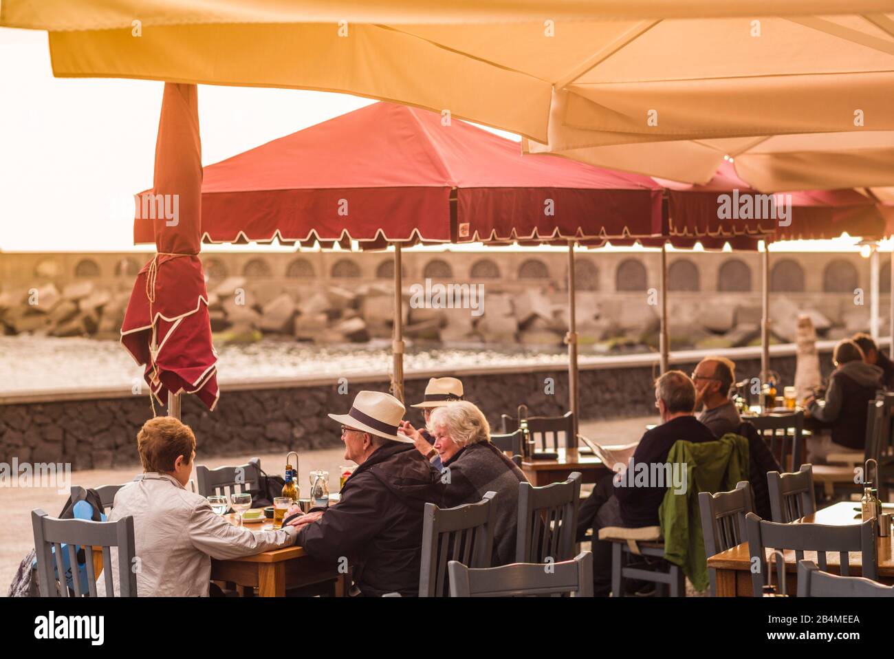 Spain, Canary Islands, La Palma Island, Tazacorte, resort town,  diners at outdoor cafe, NR Stock Photo