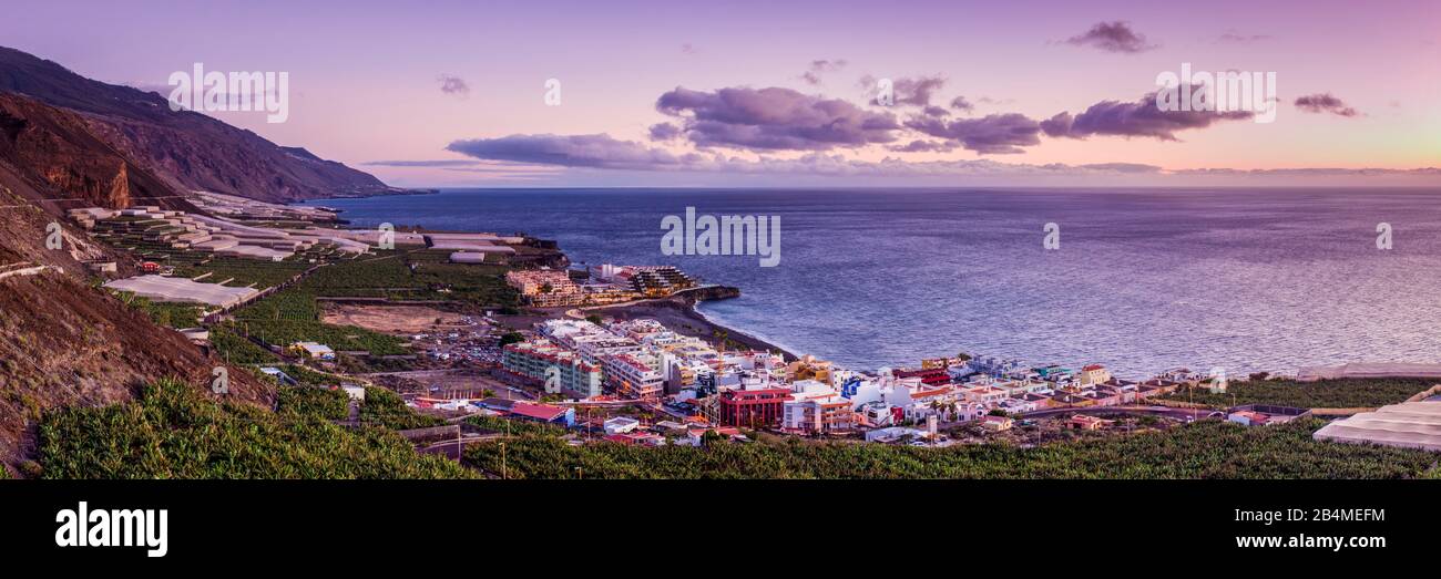 Spain, Canary Islands, La Palma Island, Puerto Naos, elevated resort town view, dusk Stock Photo