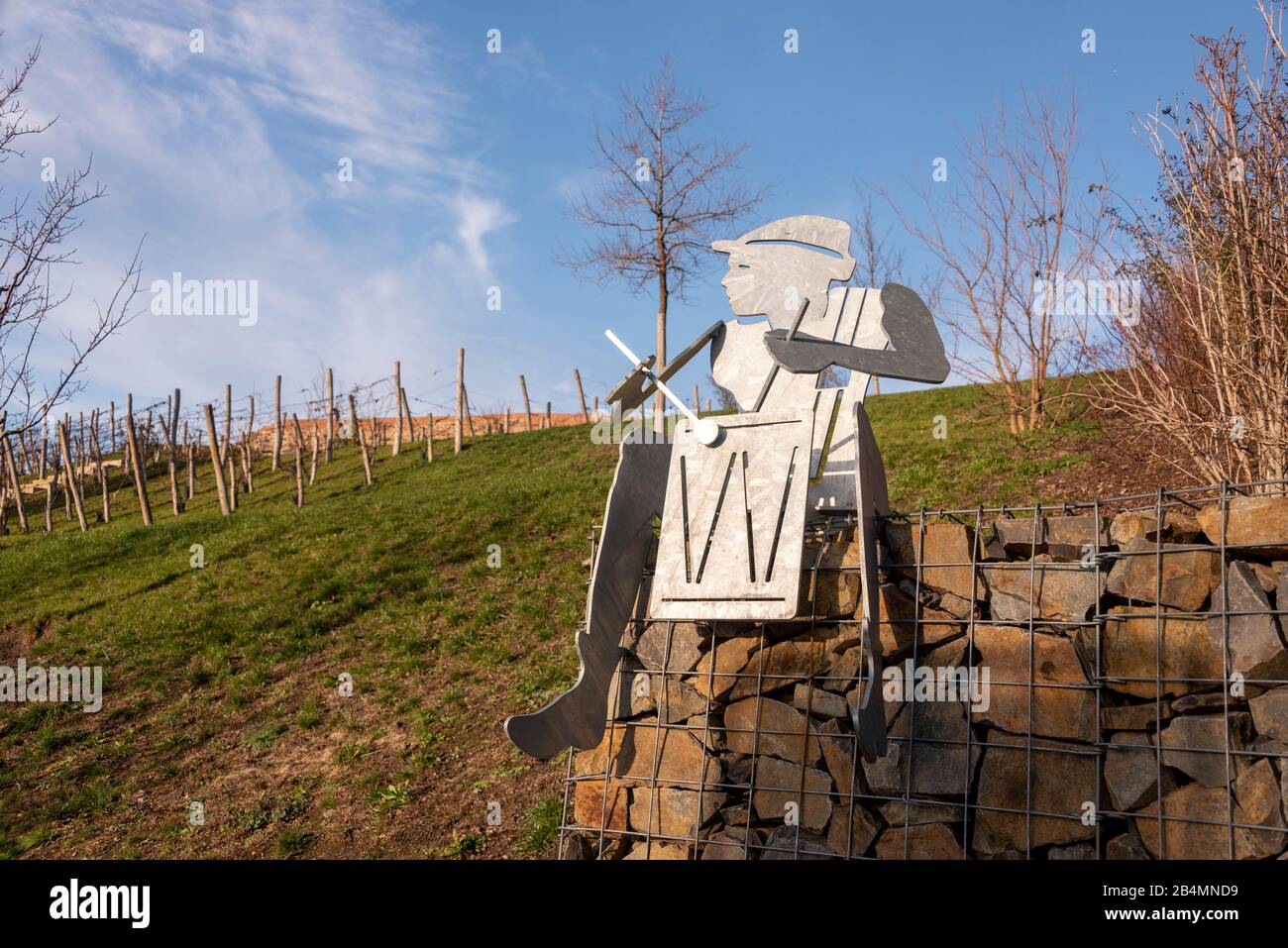 Germany, Saxony-Anhalt, Burg, a metal drummer sits on a wall at a vineyard. It recalls a legend that a young man with a drum ran into an underground passage and did not return. Stock Photo