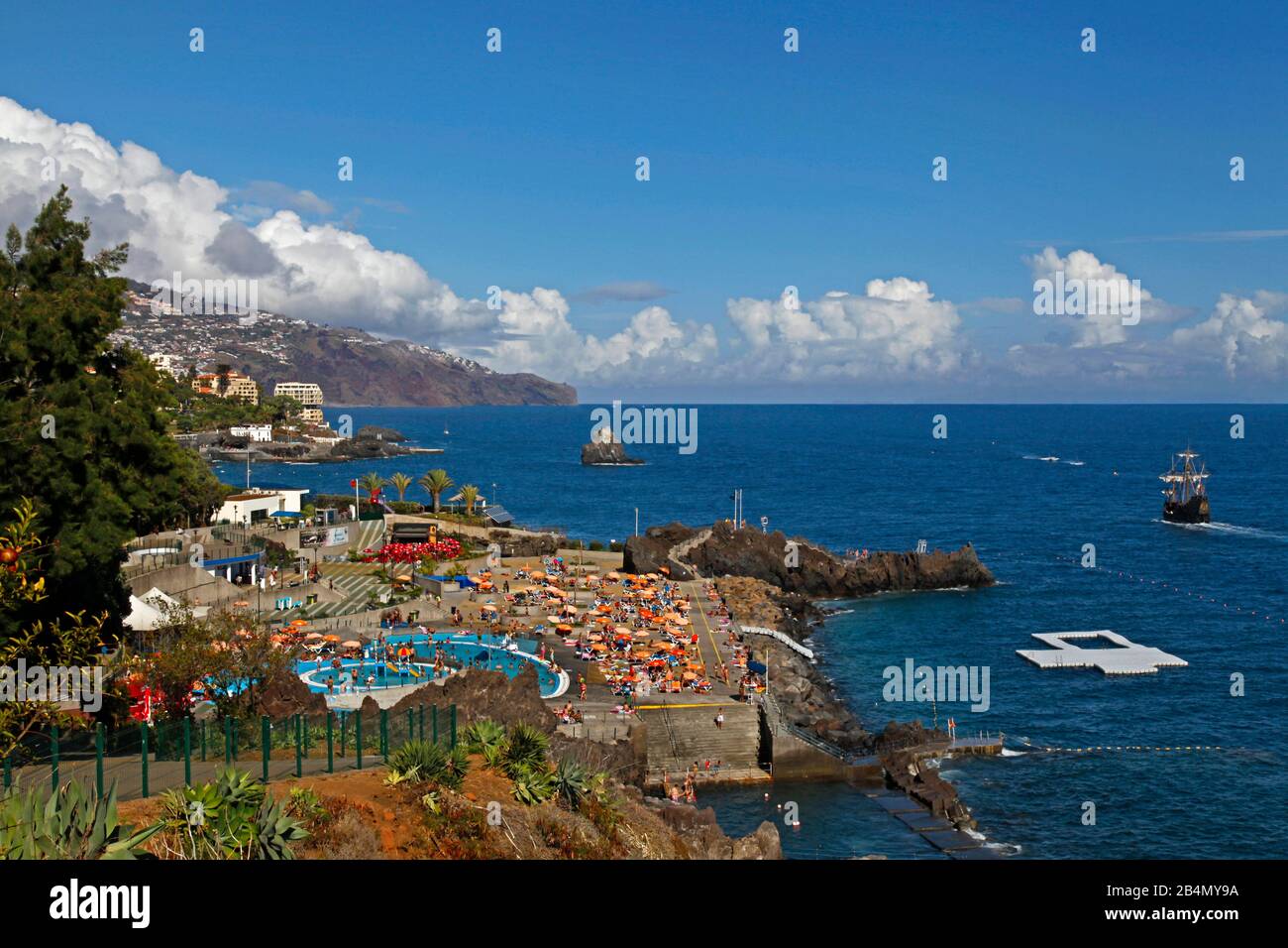 Swimming pools and sea water facilities near Hotel Baia Azul, historic sailing ship, replica of Santa Maria by Christopher Columbus, Funchal, Madeira, Portugal Stock Photo