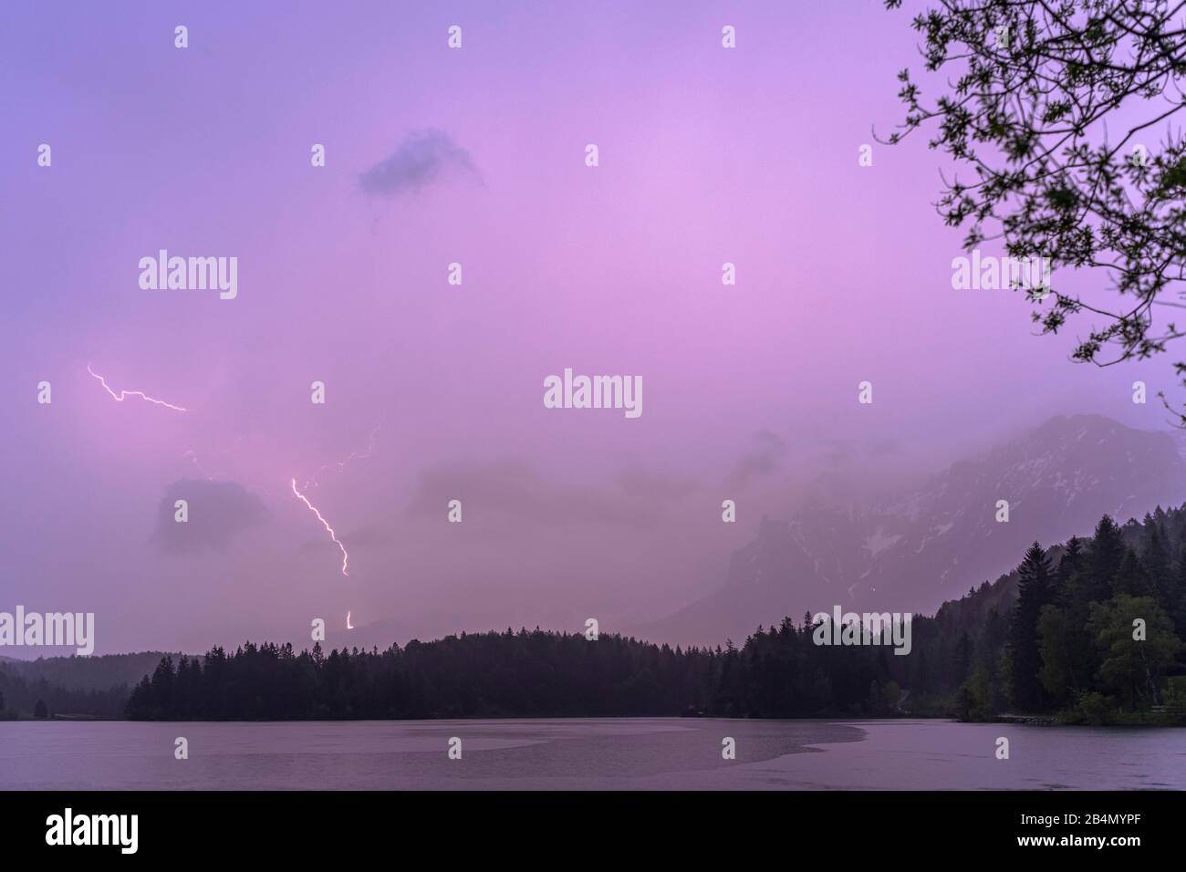 Thunderstorm and lightning strike in the Karwendel, seen at Lautersee near Mittenwald Stock Photo