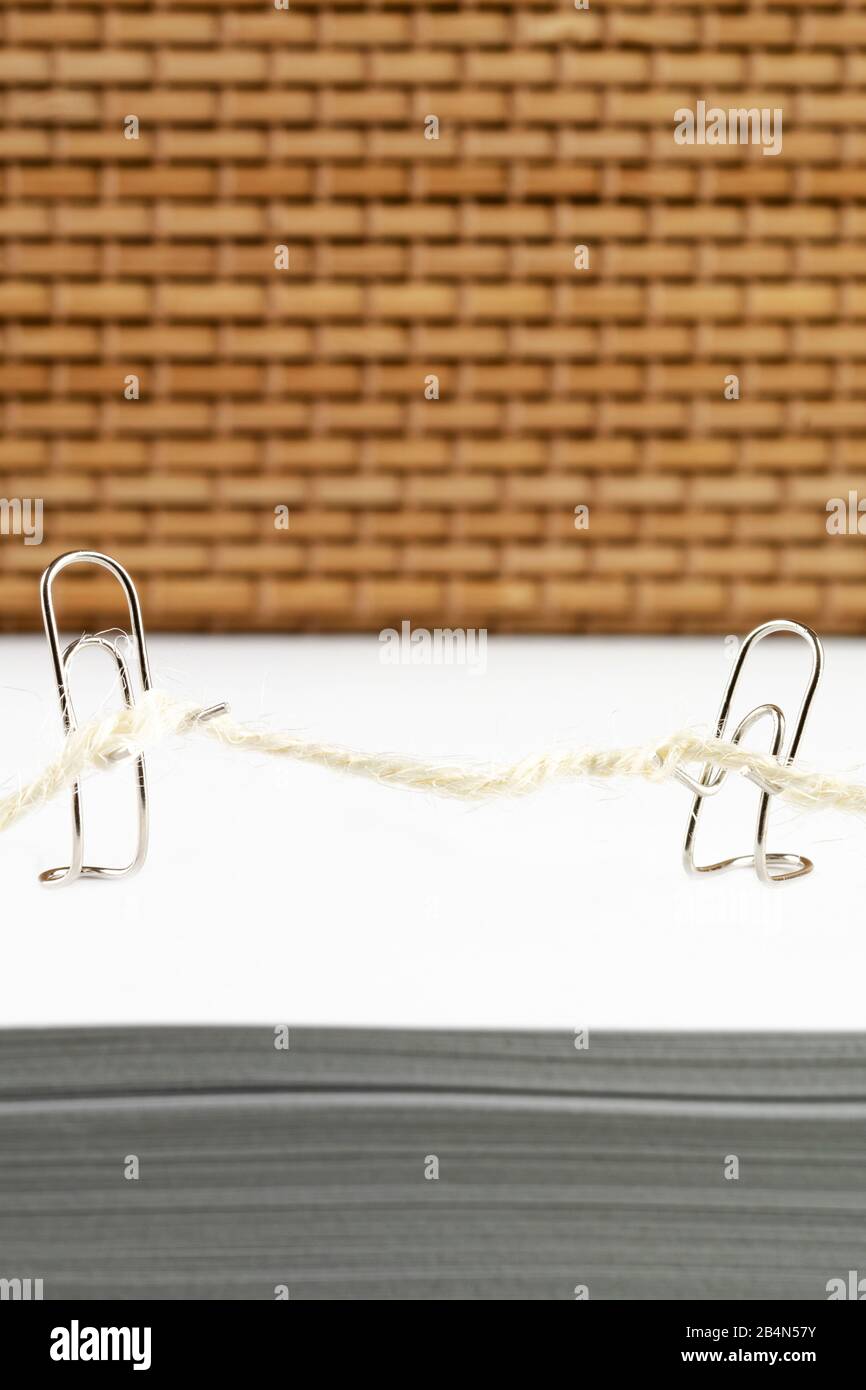 Paper clips while tug of war Stock Photo