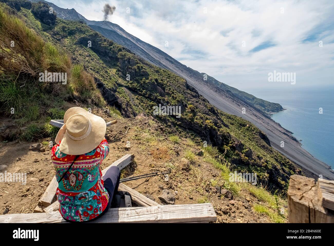 Rest at the Stromboli volcano with cloud of smoke, hiker, hiker, forest and volcanic ash, Lipari, Aeolian Islands, Aeolian Islands, Tyrrhenian Sea, Southern Italy, Europe, Sicily, Italy Stock Photo