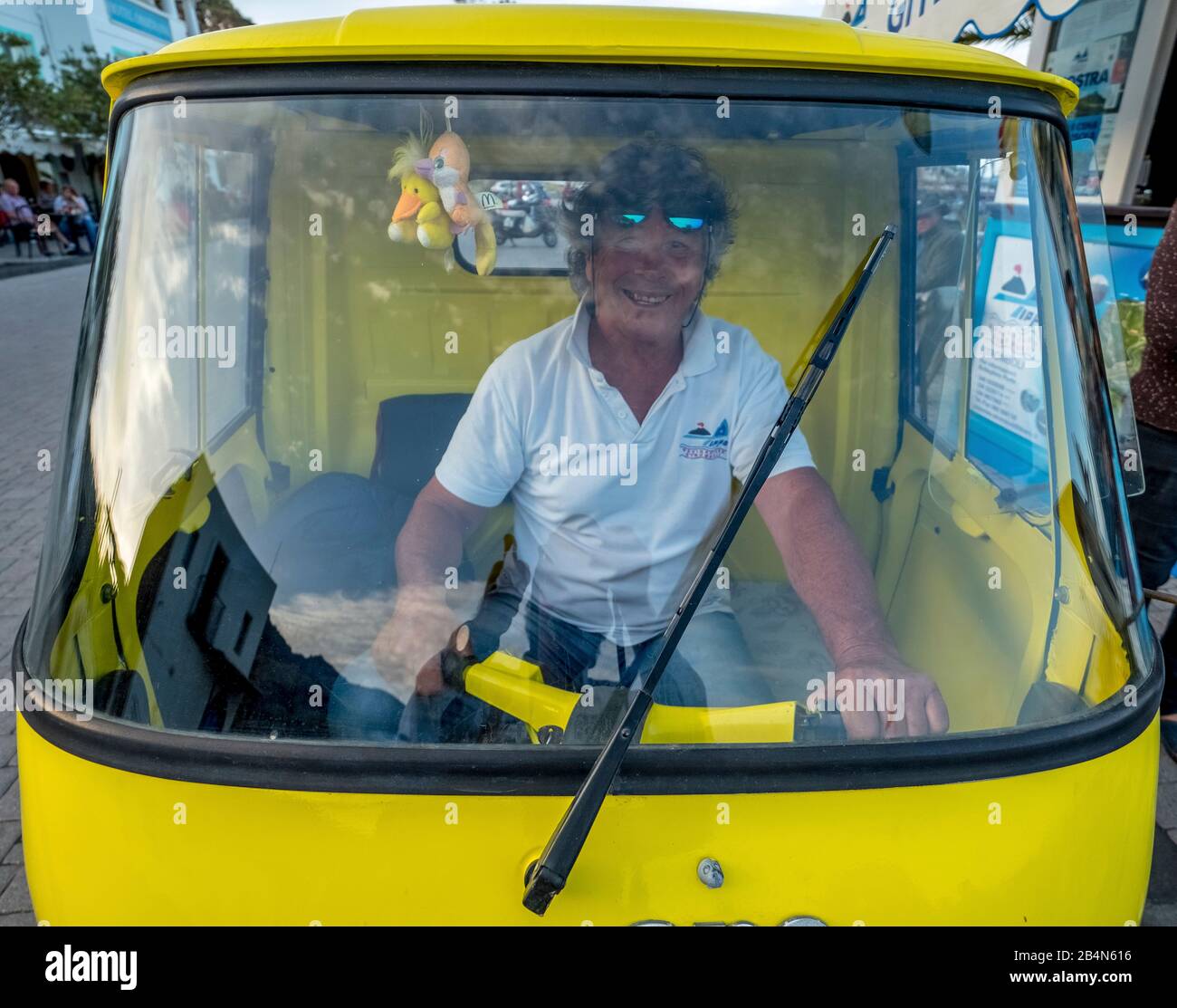 Piaggio Ape van with a laughing driver, Lipari, Aeolian Islands, Aeolian Islands, Tyrrhenian Sea, Southern Italy, Europe, Sicily, Italy Stock Photo