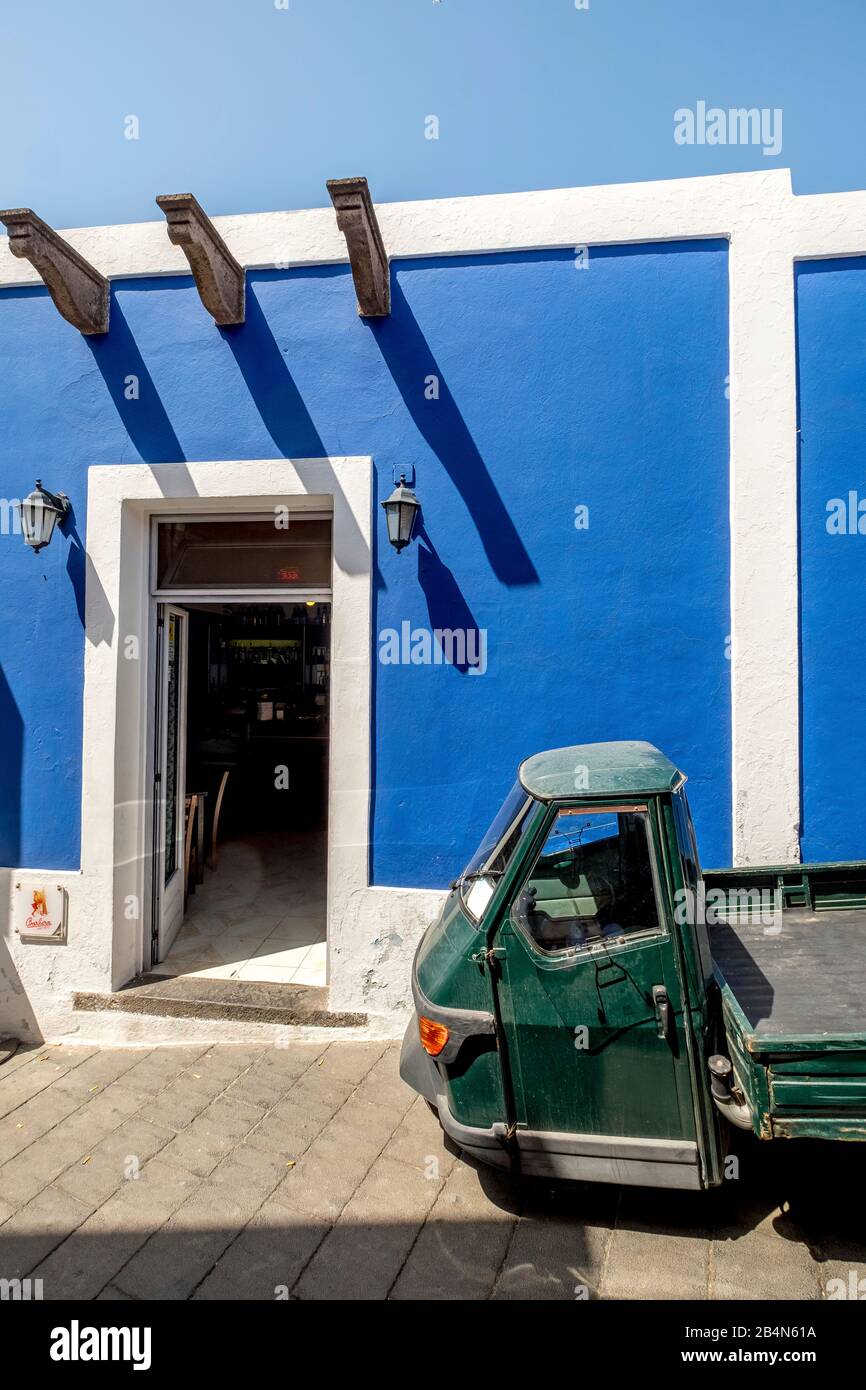 Piaggio Ape in front of cafe with blue house wall, Stromboli, Aeolian Islands, Aeolian Islands, Tyrrhenian Sea, Southern Italy, Europe, Sicily, Italy Stock Photo