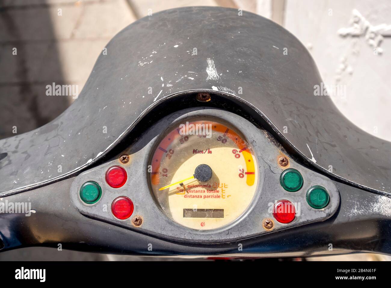 gray handlebar and speedometer of a Piaggio Ape, old weathered dashboard, handlebar, Stromboli, Aeolian Islands, Aeolian Islands, Tyrrhenian Sea, southern Italy, Europe, Sicily, Italy Stock Photo