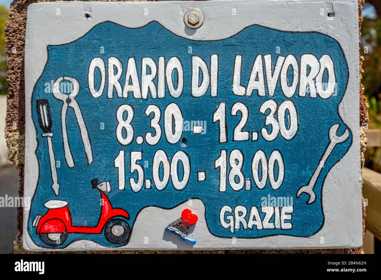 Orario Di Lavoro, working time sign of a scooter workshop, opening times, Stromboli, Aeolian Islands, Aeolian Islands, Tyrrhenian Sea, Southern Italy, Europe, Sicily, Italy Stock Photo