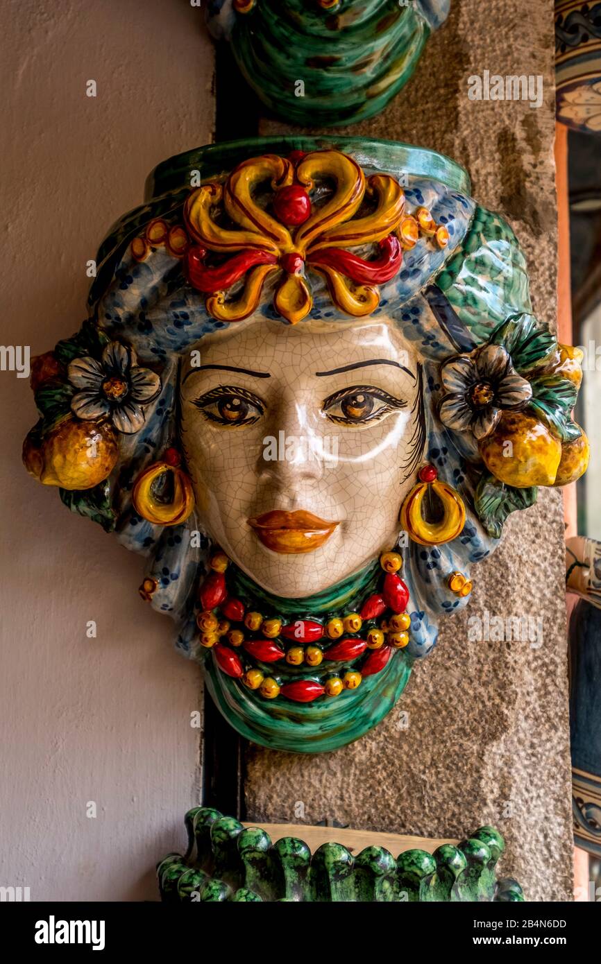 Colorfully decorated ceramic faces, Taormina, Southern Italy, Europe, Sicily, Italy Stock Photo