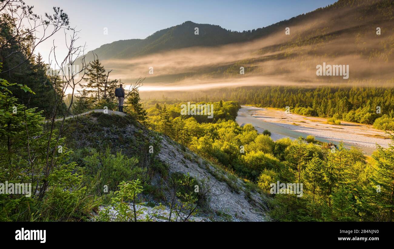 Isar Valley, Karwendel, Bavaria, Germany, man on hiking trail at sunrise and morning mood Stock Photo