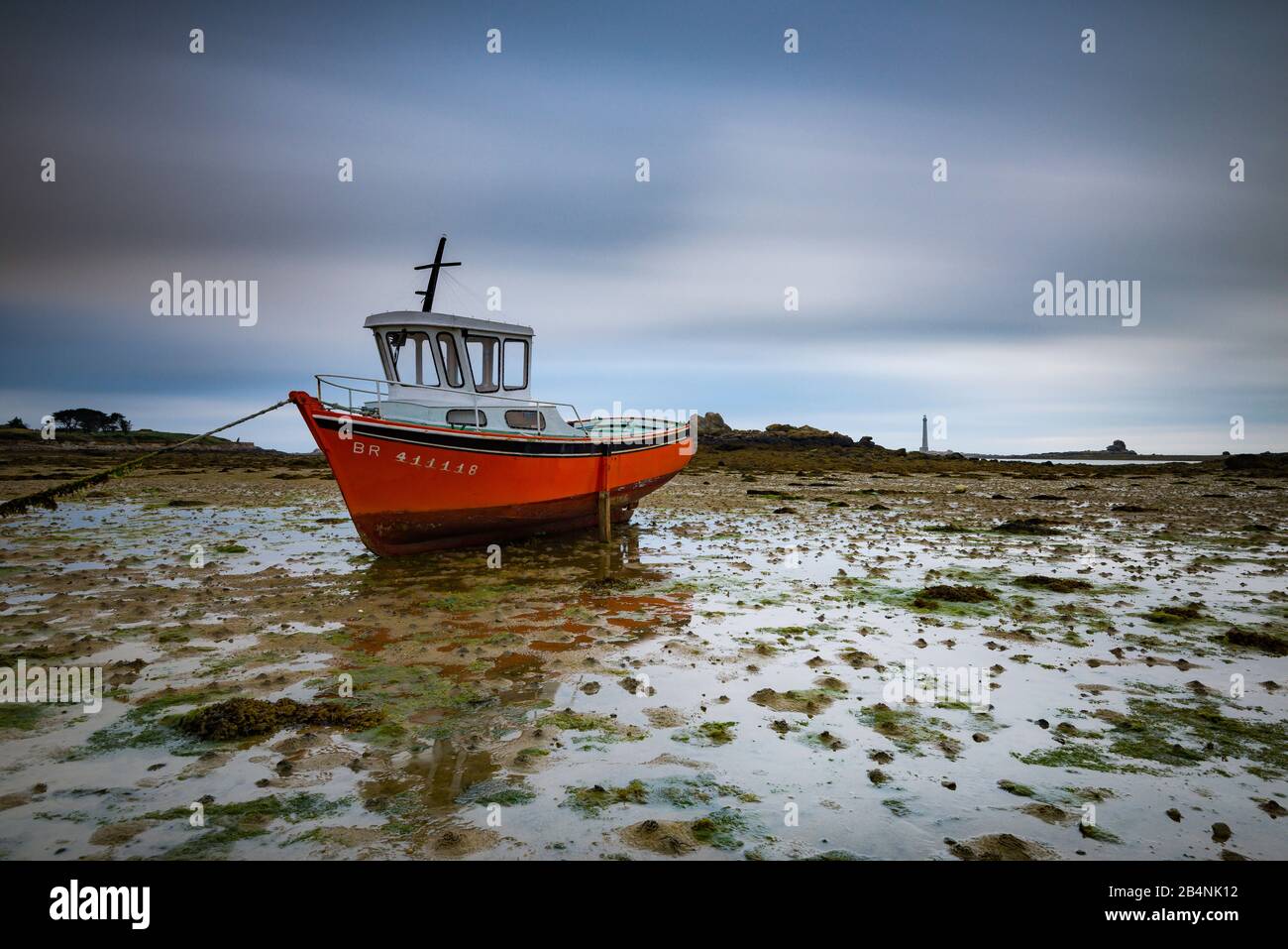 Boat at low tide in the port of Kervenni, Brittany, France Stock Photo