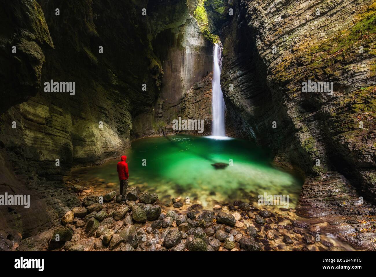 Man in front of Kozjak waterfall, Soca Valley, Slovenia Stock Photo