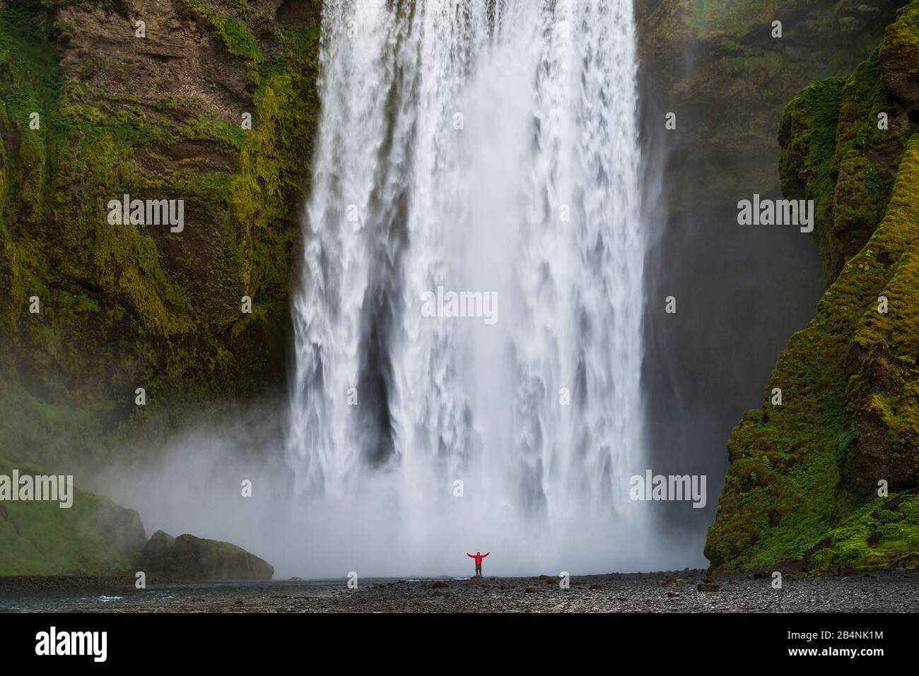 Skogafoss waterfall, Iceland, person in front of the waterfall Stock Photo