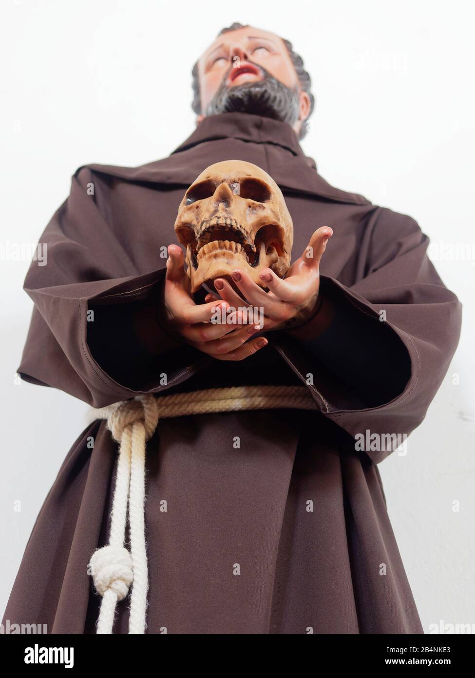 statue of priest holding a skull at Juarez Cathedral in El Paso,Texas, USA Stock Photo