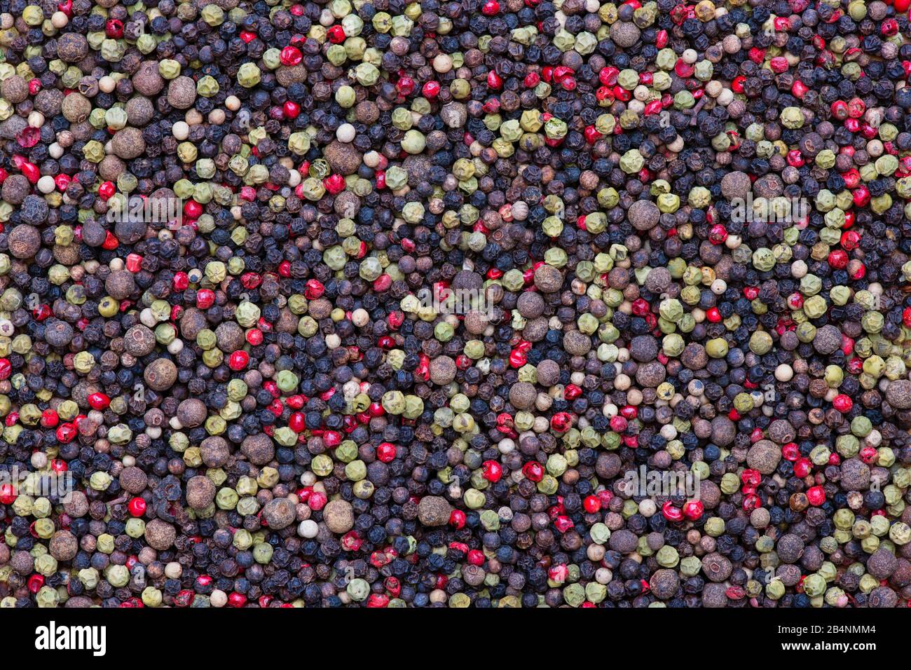 Mixed peppercorns pattern. Green, pink, black, white and pimento peppercorns Stock Photo